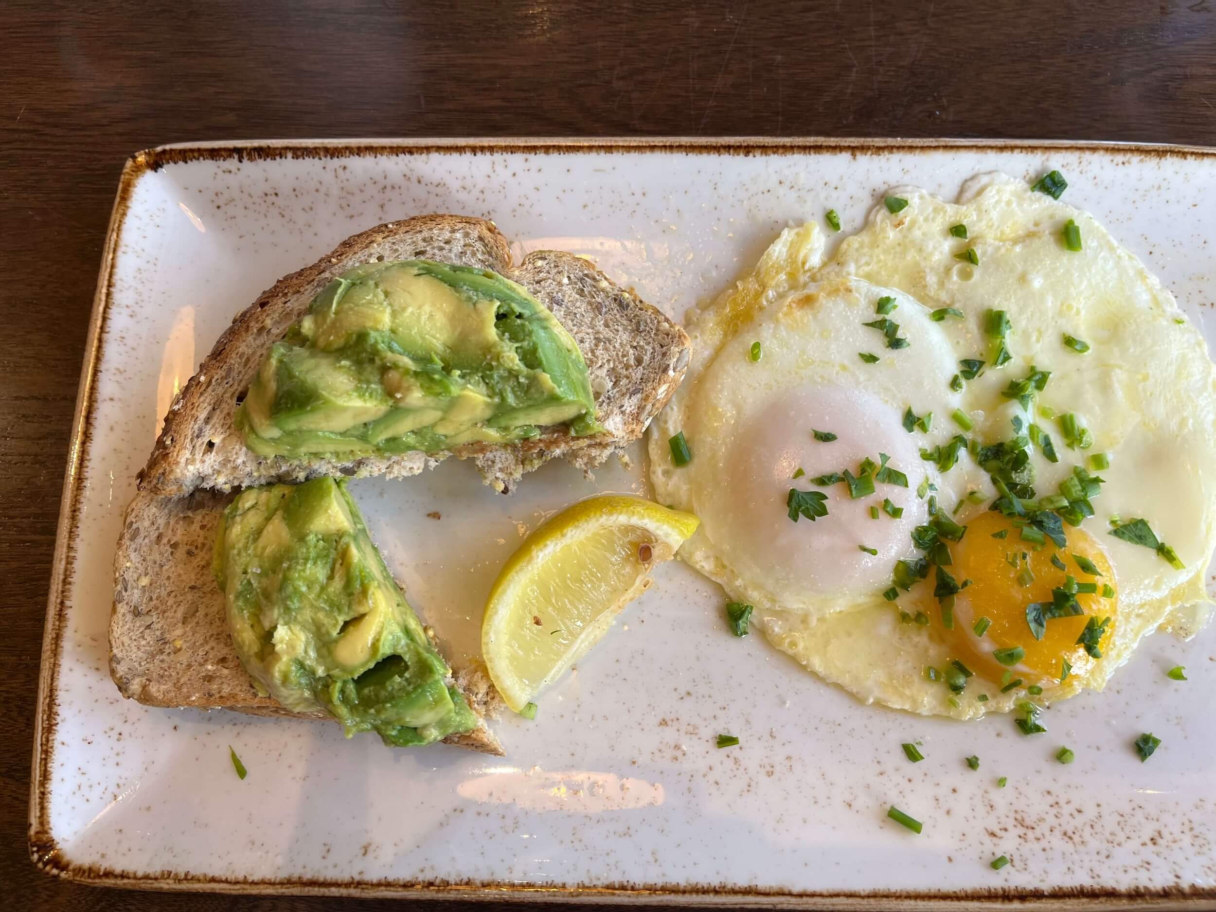 Avocado toast with poached egg, a source of healthy fats