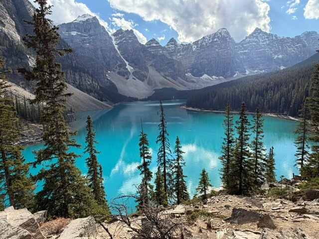 Turquoise water of Lake Agnes in Banff National Park, seen from a rocky overlook